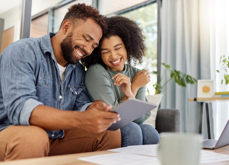 Young couple reviewing investments