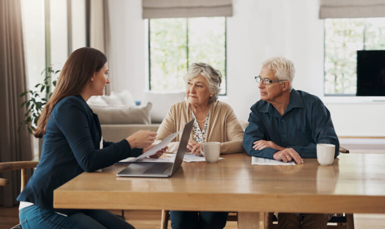 Couple speaks with financial advisor about planning for assisted living